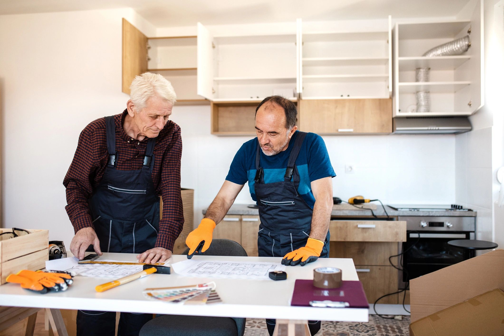 Contractors reviewing renovation plans together